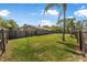 A spacious fenced-in backyard featuring a patio area perfect for outdoor living at 1191 Tracy Dr, Port Orange, FL 32129