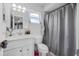 Bathroom with a white vanity, chrome fixtures, and shower with curtain at 1191 Tracy Dr, Port Orange, FL 32129
