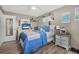 Cozy bedroom featuring a plush bed, ample natural light, and stylish decor at 1191 Tracy Dr, Port Orange, FL 32129