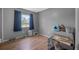 Neutral bedroom with a large window and hard surface flooring at 1191 Tracy Dr, Port Orange, FL 32129