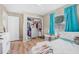 Bright bedroom features a large closet, big window, and neutral wall color at 1191 Tracy Dr, Port Orange, FL 32129