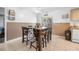 Dining room with a wood table and six chairs, tile floors, and sliding glass door at 1191 Tracy Dr, Port Orange, FL 32129