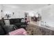 Spacious living room featuring comfortable seating, natural light, and tile floors at 1191 Tracy Dr, Port Orange, FL 32129