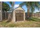 Durable outdoor storage shed with double doors, windows and a neutral color scheme at 1191 Tracy Dr, Port Orange, FL 32129