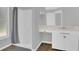 Well lit bathroom with a shower, vanity and sink, and wood-look flooring at 1194 Balfour Dr, Deltona, FL 32725