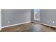 Bedroom with hardwood floors, neutral paint, and a bright window at 1194 Balfour Dr, Deltona, FL 32725