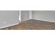 Bedroom with wood-look floors leading into a bathroom at 1194 Balfour Dr, Deltona, FL 32725