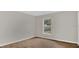 Bedroom with a view of the backyard through a bright window and wood floors at 1194 Balfour Dr, Deltona, FL 32725