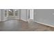 Bedroom with a bay window and wood floors, leading to a bathroom at 1194 Balfour Dr, Deltona, FL 32725
