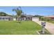 Charming single-story home with landscaped front yard and attached two-car garage at 1194 Balfour Dr, Deltona, FL 32725