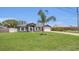 Well-maintained single-story home with landscaped front yard and attached two-car garage at 1194 Balfour Dr, Deltona, FL 32725