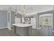 The large island with sink is the focal point of this bright kitchen and is great for entertaining at 1194 Balfour Dr, Deltona, FL 32725