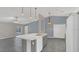 Spacious kitchen with center island and stainless appliances offers style and function at 1194 Balfour Dr, Deltona, FL 32725
