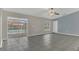 Open living room with sliding glass doors leading to a pool area and tile flooring at 1194 Balfour Dr, Deltona, FL 32725