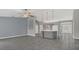 Open-concept living room with tile flooring flows into the kitchen, great for entertaining at 1194 Balfour Dr, Deltona, FL 32725