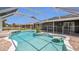 Enjoy Florida living with this screened-in pool, complete with sun shelf and patio at 1194 Balfour Dr, Deltona, FL 32725