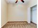 Carpeted bedroom with ceiling fan, walk-in closet with wire shelving at 12079 Alder Branch Loop, Orlando, FL 32824