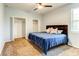 Spacious bedroom featuring carpet, a ceiling fan, and a modern wood headboard at 12079 Alder Branch Loop, Orlando, FL 32824