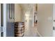 Entrance foyer featuring neutral tile flooring, a decorative barrel, and a view into other rooms at 12079 Alder Branch Loop, Orlando, FL 32824