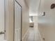 Hallway with tile floors leading to a living room area at 12079 Alder Branch Loop, Orlando, FL 32824
