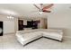 Open living room featuring tile floors and a view of the kitchen with granite countertops at 12079 Alder Branch Loop, Orlando, FL 32824
