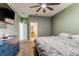 Main bedroom with adjacent bathroom and large bed at 12079 Alder Branch Loop, Orlando, FL 32824