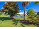 Scenic backyard featuring a serene pond and lush landscaping, perfect for outdoor enjoyment at 1233 Girog Ave, Port Orange, FL 32129