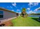 Well-maintained backyard with lush lawn and view of serene lake at 1233 Girog Ave, Port Orange, FL 32129