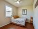 Cozy bedroom with natural light, tile floors and ceiling fan, providing a relaxing retreat at 1233 Girog Ave, Port Orange, FL 32129