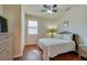 Charming bedroom with neutral decor, window with shutters, and closet, offering a serene and inviting atmosphere at 1233 Girog Ave, Port Orange, FL 32129