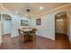 Inviting dining area with stylish lighting, tiled floors, and adjacent views of the entryway at 1233 Girog Ave, Port Orange, FL 32129