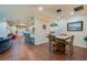 Open-concept dining area with tile floors, stylish pendant lighting, and seamless flow to the living room at 1233 Girog Ave, Port Orange, FL 32129