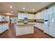 Open kitchen with granite countertops, stainless steel appliances, and white cabinetry at 1233 Girog Ave, Port Orange, FL 32129