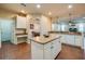Open kitchen with granite countertops, island with storage, and stainless steel appliances at 1233 Girog Ave, Port Orange, FL 32129