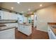 Spacious kitchen with island, modern appliances, and white cabinets offering ample storage space at 1233 Girog Ave, Port Orange, FL 32129