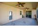 Covered porch with ceiling fans and views of the backyard at 1233 Girog Ave, Port Orange, FL 32129