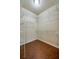 A spacious walk-in closet features built-in shelving and durable tile flooring, perfect for organized storage at 1233 Girog Ave, Port Orange, FL 32129