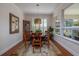 Formal dining room featuring a hardwood table, six chairs, and plenty of natural light at 1386 Brayford Pt, Deland, FL 32724