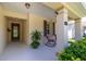 Charming front porch with outdoor seating and lush landscaping; perfect spot for relaxing at 1386 Brayford Pt, Deland, FL 32724