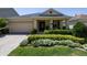 Charming single-story home with a well-manicured front yard and inviting entrance at 1386 Brayford Pt, Deland, FL 32724