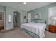 Serene main bedroom with ensuite bathroom access, comfortable bedding, and ample closet space at 1386 Brayford Pt, Deland, FL 32724