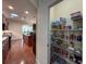 Walk-in pantry features wire shelving, abundant storage space, and easy access from the kitchen at 1386 Brayford Pt, Deland, FL 32724