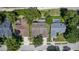 An aerial view of homes with fenced-in swimming pools and well-maintained lawns at 1412 Bent Oaks Blvd, Deland, FL 32724