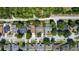 An overhead view of residential properties with neatly manicured lawns in a suburban neighborhood at 1412 Bent Oaks Blvd, Deland, FL 32724