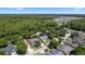 A neighborhood aerial view showing property lines, swimming pools, and proximity to natural areas at 1412 Bent Oaks Blvd, Deland, FL 32724
