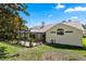 A screened porch with lush lawn creates a relaxing outdoor living space at 1412 Bent Oaks Blvd, Deland, FL 32724