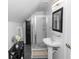 Modern bathroom with a glass-enclosed shower, sleek vanity, and stylish finishes at 1412 Bent Oaks Blvd, Deland, FL 32724