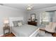 Cozy bedroom with neutral tones, a comfortable bed, and natural light from the window at 1412 Bent Oaks Blvd, Deland, FL 32724
