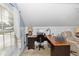 Bonus room includes a chair, desk, and natural light through the large window at 1412 Bent Oaks Blvd, Deland, FL 32724