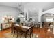 Dining room with wood floors, decorative sideboard and seating for six at 1412 Bent Oaks Blvd, Deland, FL 32724